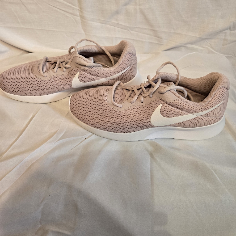 Nike Women's Light Pink Athletic Shoes with White Swoosh